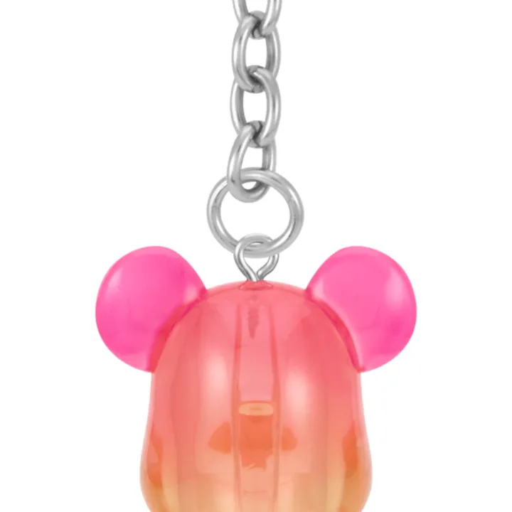 Back view of the pink and yellow TWICE x BE@RBRICK 100% keychain showing the TWICE logo and heart-shaped clasp