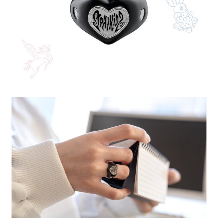 Official product detail and reading lifestyle view of the Stray Kids 6th Fan Meeting ring.