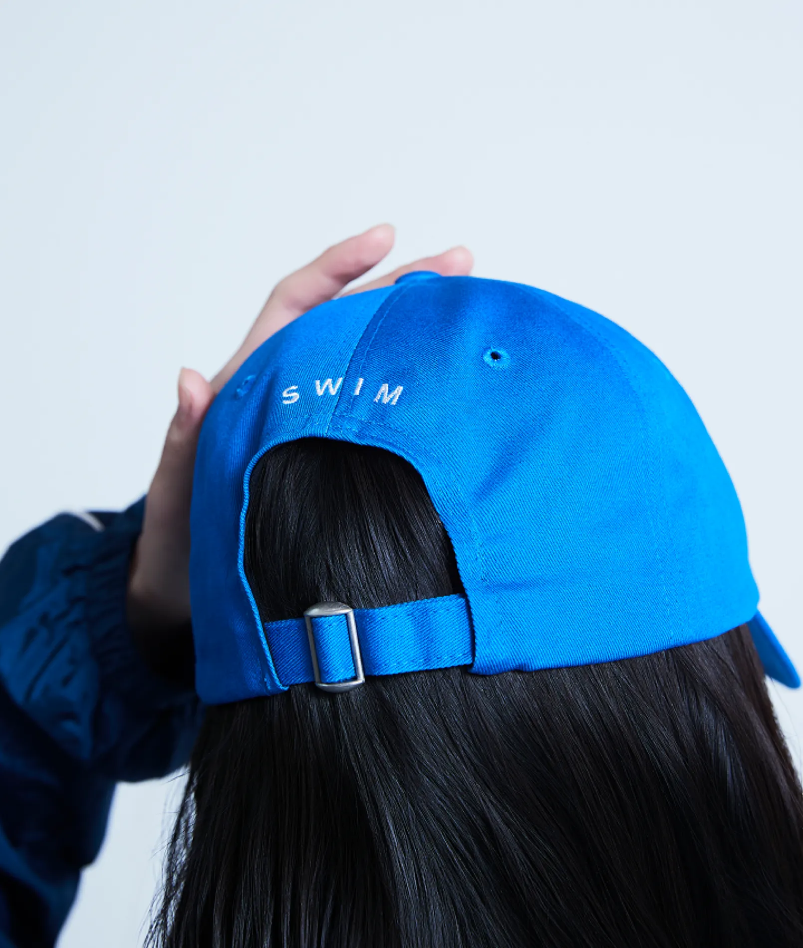 BTS SWIM Ball Cap (BLUE) official rear lifestyle view with adjustable strap