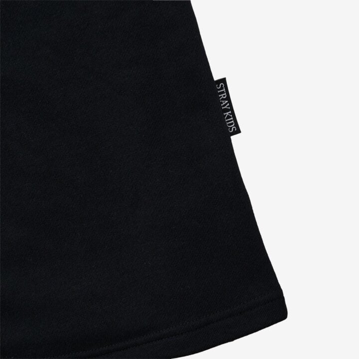 Logo tag detail of the Stray Kids RUN IT JAPAN official shorts