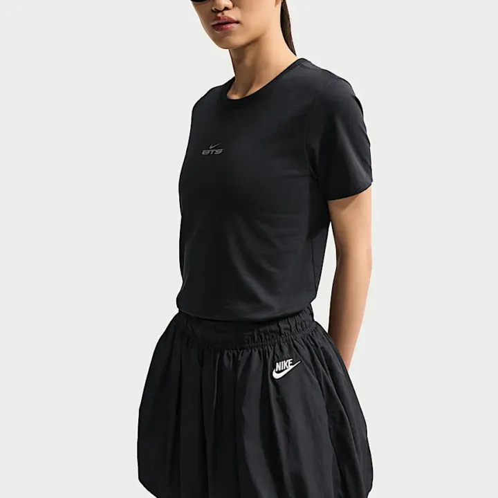 BTS x Nike black T-shirt official three-quarter front model view