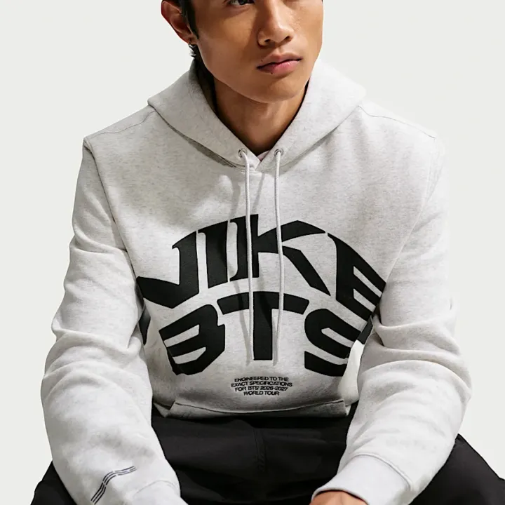 BTS x Nike white hoodie official seated front model view