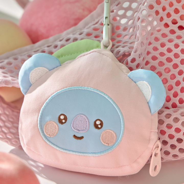 BT21 Peach Holic KOYA pink character face pouch with zipper and clip in an official styled display