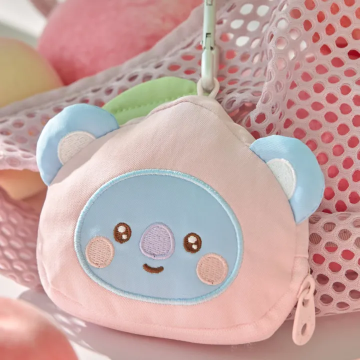 BT21 Peach Holic KOYA pink character face pouch with zipper and clip in an official styled display