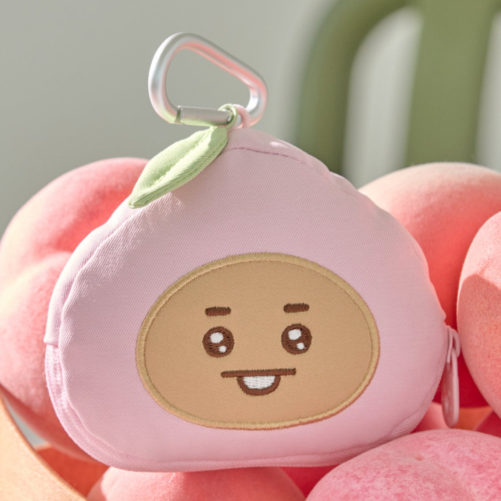 BT21 Peach Holic SHOOKY pink character face pouch with zipper and clip in an official styled display
