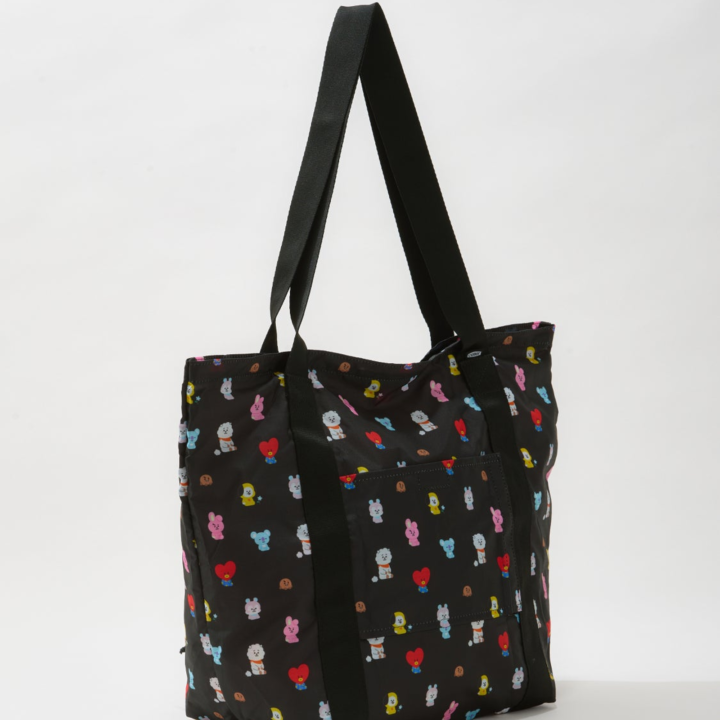 BT21 Travel black folding bag shown from the side with character print and long handles